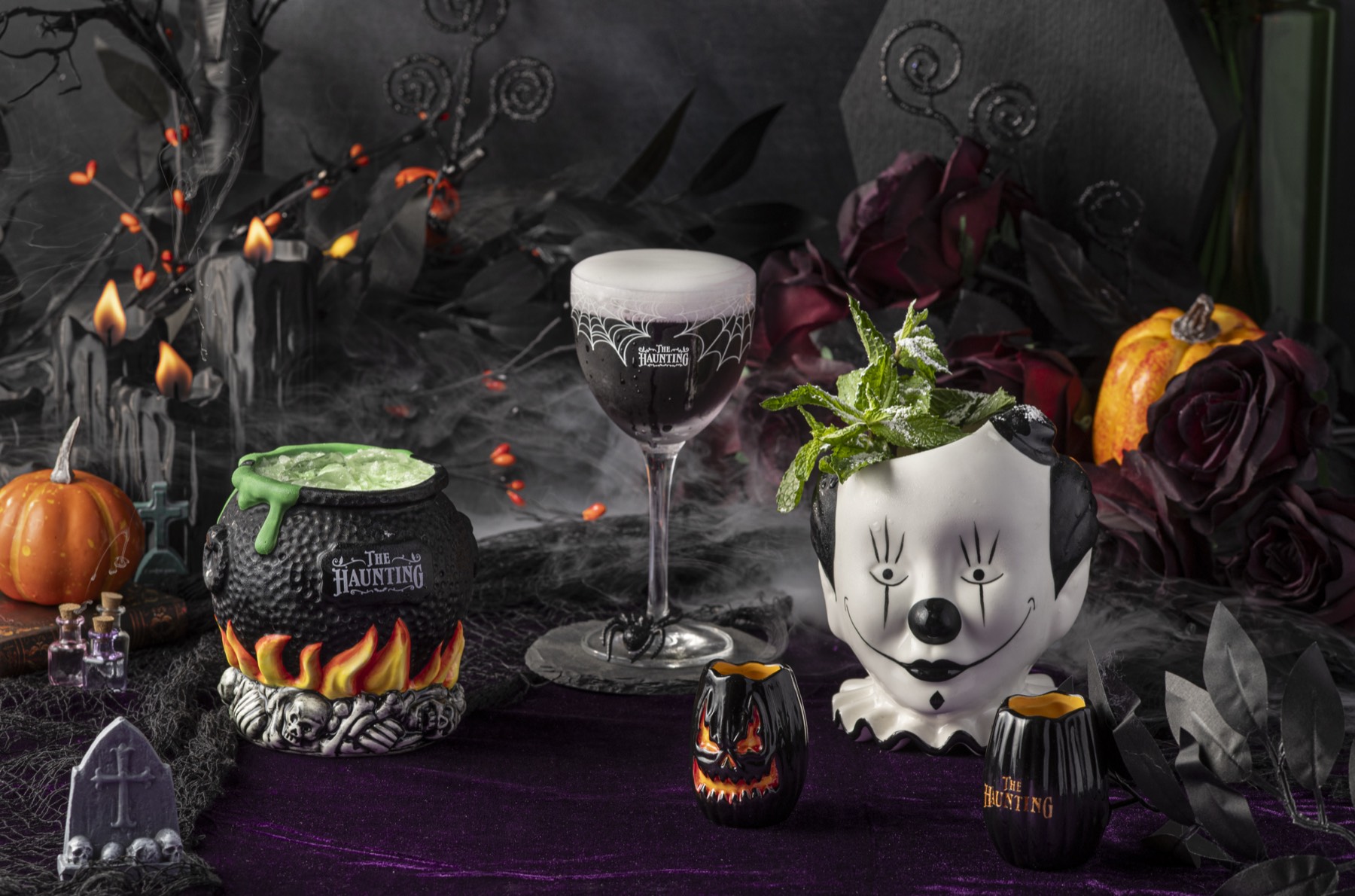 The full Haunting 2026 cocktail lineup arranged on purple velvet in a graveyard set.